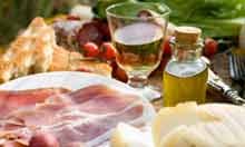 Prosciutto ham, cheese, tomatoes, white wine, bread and olive oil