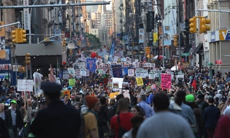 Demonstrators march down Broadway during a May Day protest in New York City.