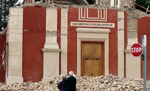 earthquake in italy: People stand in front of a damaged church
