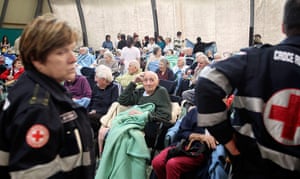 earthquake in italy: Elderly people receive first aid after an earthquake in Finale Emilia