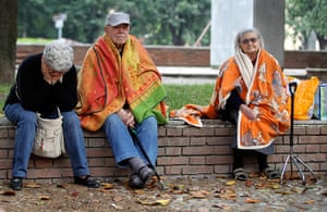 earthquake in italy: Elderly residents sit outdooors after the earthquake