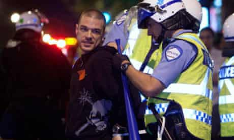 Police detain a protester in Montreal