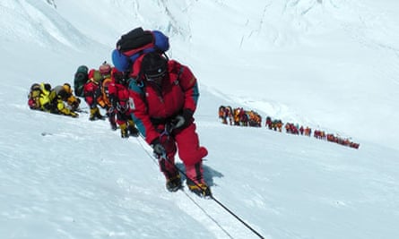A photograph of a line of climbers taken on Everest