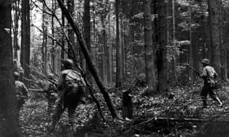 US troops march through Hurtgen Forest, Germany, 1944
