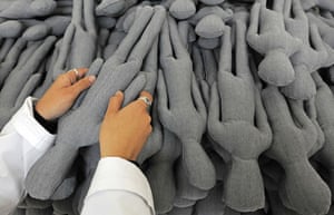 dOCUMENTA (13): A artist arranges voodoo dolls as part of Sanatorium