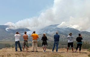 Colorado wildfires: People gather on a hill to watch the High Park wildfire near Fort Collins