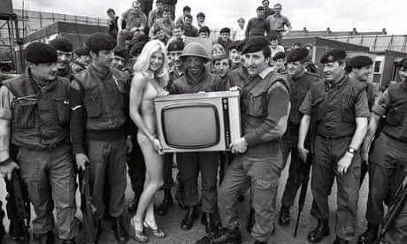Page Three girl with Belfast troops 1974