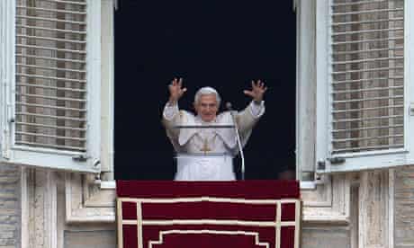 Pope Benedict XVI salutes from the window of his apartments