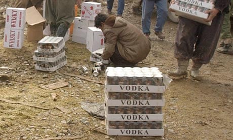 Iranian Kurdish men smuggle alcohol from Iraq to Iran, where liquor is banned