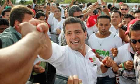 The PRI candidate Enrique Peña Nieto greets supporters