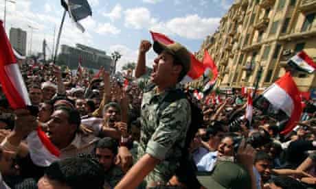 An Egyptian army officer chants slogans during a rally in Cairo