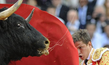 Spanish matador Julian 'El Juli' Lopez performs a pass during a bullfight. 
