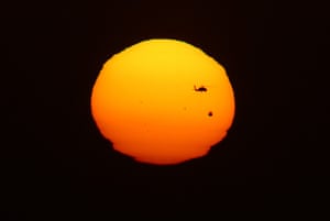 Transit Venus : A helicopter flies past during the transit of Venus over Tijuana, Mexico