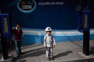 24 hours in pictures: A boy wears an outfit made of newspaper for World Environment Day