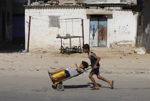 Gaza life: A Palestinian boy sits on top of a plast