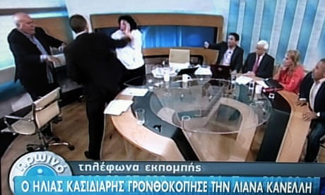 Ilias Kasidiaris strikes Liana Kanelli, a Greek Communist MP