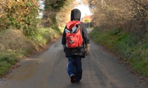 child walking along road