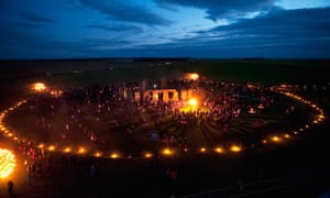 Stonehenge lit up early on 11 July 2012 with fire sculptures and candle-lit paths to mark Olympics