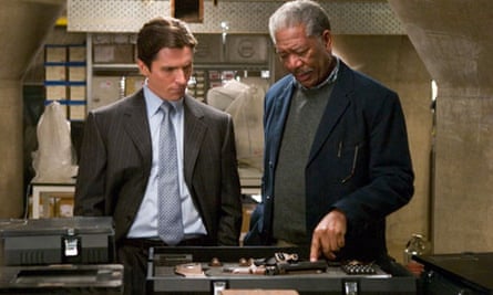 Freeman with Christian Slater in The Dark Knight Rises.