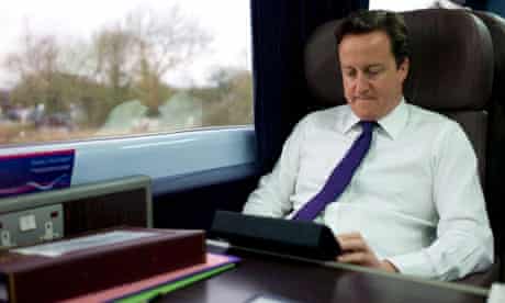 David Cameron on a train last year to Swansea, where the railway line is to be electrified