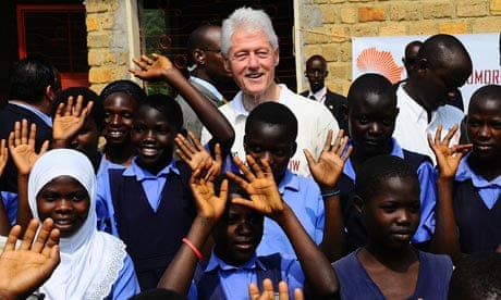 Bill Clinton with school pupils in Uganda