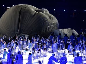 A giant model baby and nurses represent the NHS in a sequence during the London 2012 opening ceremony