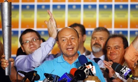 Romania's suspended President Traian Basescu celebrates
