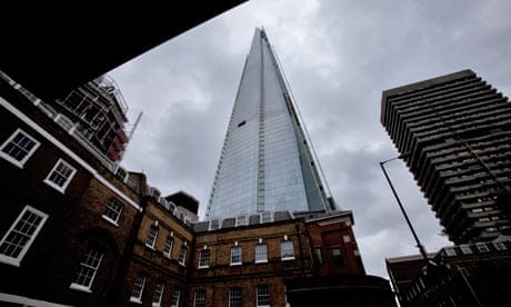 The Shard tower dwarfs nearby high-rise towers and townhouses.