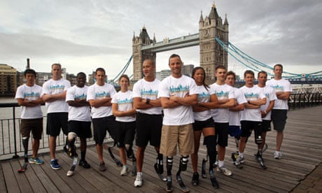 South Africa's Oscar Pistorius stands before Tower Bridge with some of the world's top Paralympians