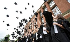 Mortar boards fly through the air as Law graduates celebrate