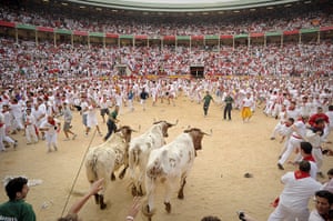 Pamplona: Participants run in front of Dolores Ybarra's bulls
