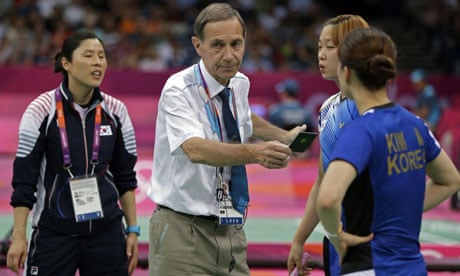 Olympic badminton head referee Torsten Berg issues a black card to both teams during a doubles match