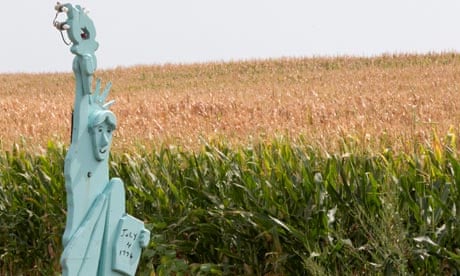 Lady Liberty stands in front of a parched corn field in Nebraska