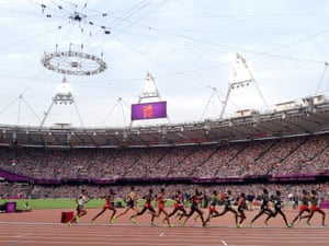 Mo Farah works his way up the field in the 5000m.