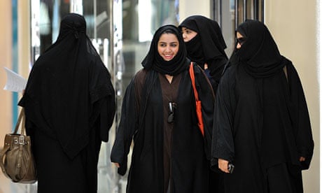 Saudi women walk inside the Faysalia shopping centre in Riyadh