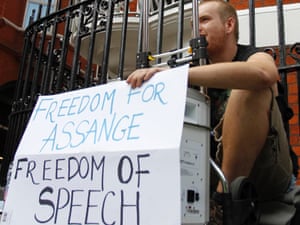 A supporter of WikiLeaks founder Julian Assange shows his support outside the Ecuadorian Embassy