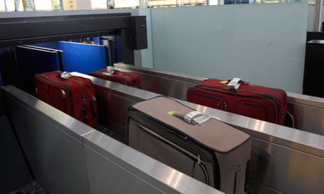Suitcases going through the X-ray machine at Terminal 5 at Heathrow Airport