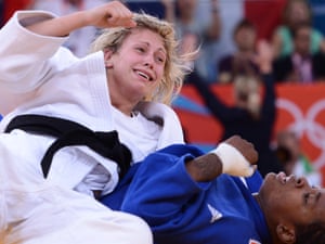 Britain's Gemma Gibbons reacts after winning against France's Audrey Tcheumeo (blue) during their women's -78kg judo contest semi-final match. Gibbons will now definitely get a gold or silver medal