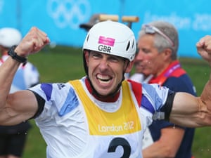 The face of someone happy with his gold medal, Etienne Stott of Great Britain celebrates after the Men's Canoe Double Slalom final
