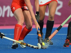 Team GB's Emily Maguire that's dribbling past Belgium's Lieselotte Van Lindt and Gaelle Valcke