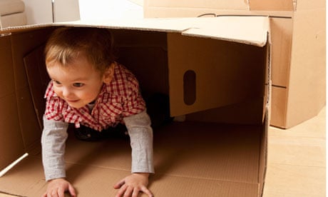 Child playing in box
