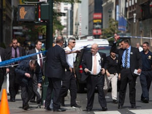 Law enforcement officials at the scene of a shooting near the Empire State Building in New York.