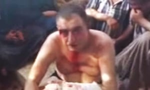 Image from amateur video shows an Assad loyalist before being executed by rebels in Aleppo. Photo: screengrab/AP