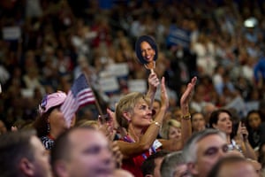 Republican convention: A delegate claps holding a mask of Condoleezza Rice as she speaks