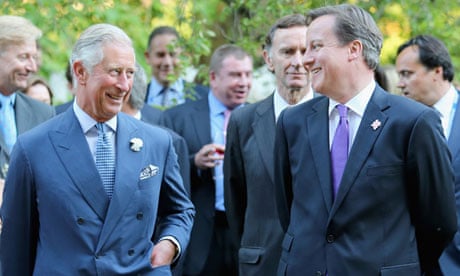 Prince Charles and David Cameron chat at a reception at Clarence House