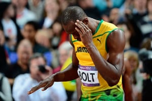 Bolt's Ticks: Usain Bolt dances prior to taking the start of the men's 100m final