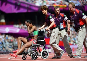 Olympic pain: Ethiopia's Genzebe Dibaba leaves the field in a wheelchair