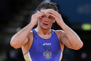 Olympic pain: Alan Khugaev of Russia tapes up an injury in Greco Roman  Wrestling
