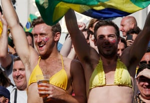 weirdsport: Male fans wearing bikini tops cheer during the women's beach volleyball 