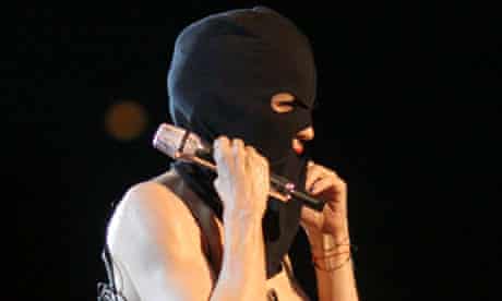 Madonna performs wearing Pussy Riot's trademark balaclava during her Moscow concert